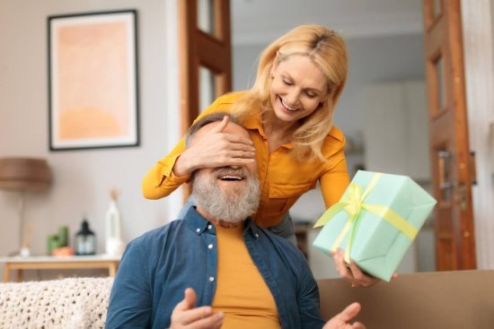 wife giving retirement gift for husband