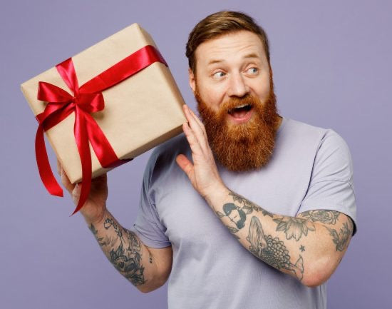 https://www.homewetbar.com/blog/wp-content/uploads/2023/12/bearded-man-holding-gift-box-550x433.jpg