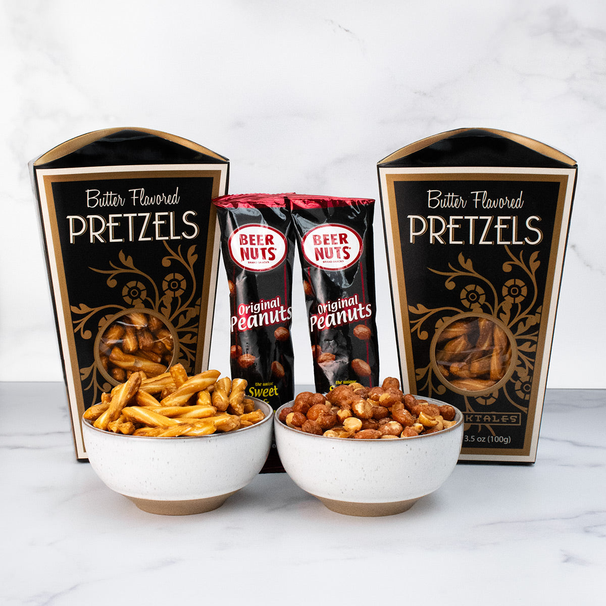 An assortment of savory pretzels and beer nuts in bowls