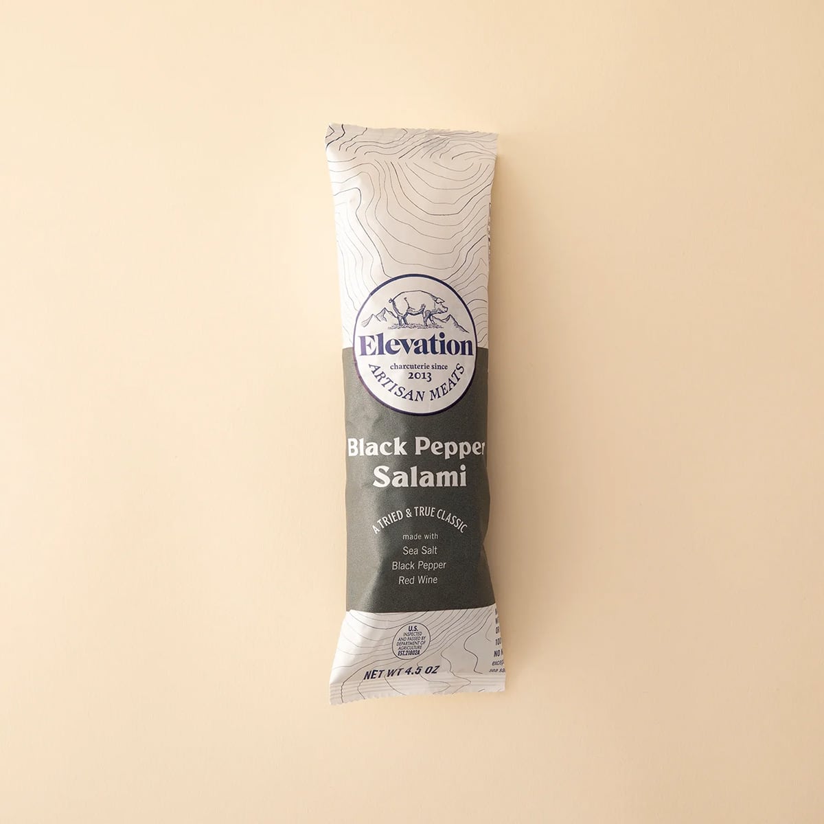 A package of savory black pepper salami