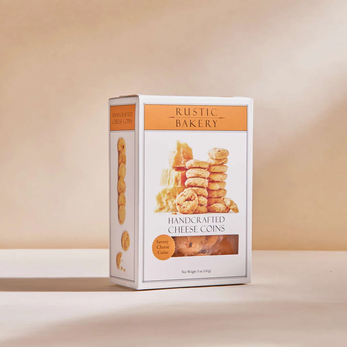 A box of handcrafted savory cheese coin crackers